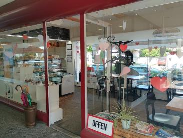Confiserie Flubacher - Eingang zum Laden und Café